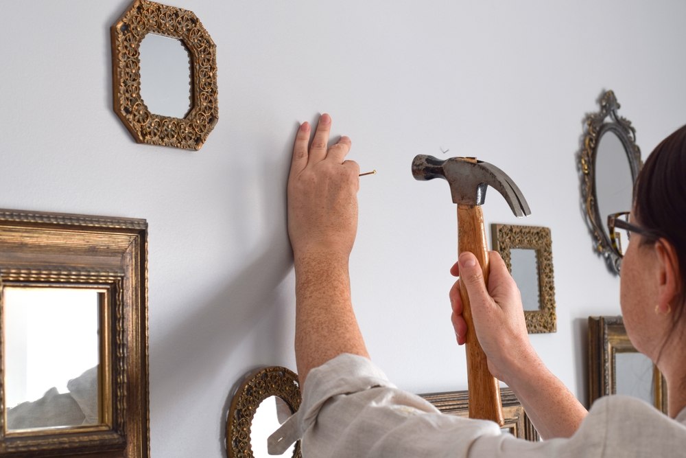 Nail in a wall to hang a frame 